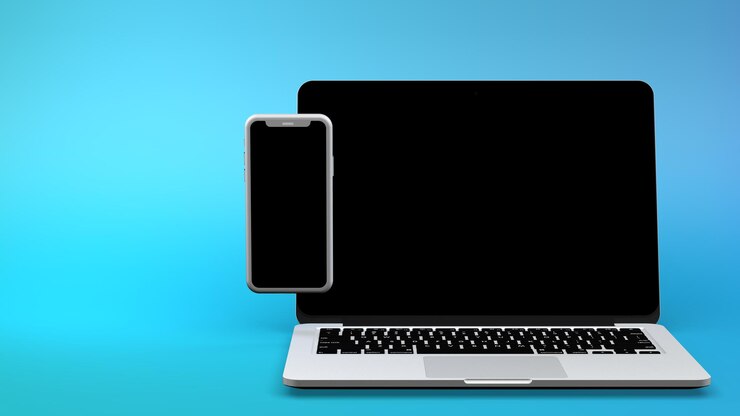 Zdjęcie laptop i smartfon na niebieskim tle. renderowanie 3d