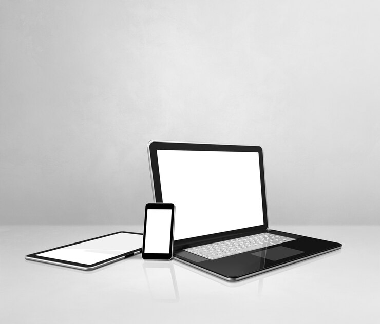 Zdjęcie laptop, telefon komórkowy i cyfrowy tablet na białym biurku betonowym. ilustracja 3d