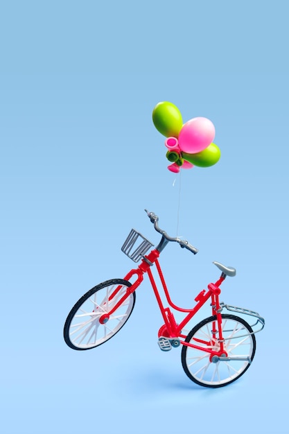 Latający rower z kilkoma balonami przywiązanymi do kierownicy
