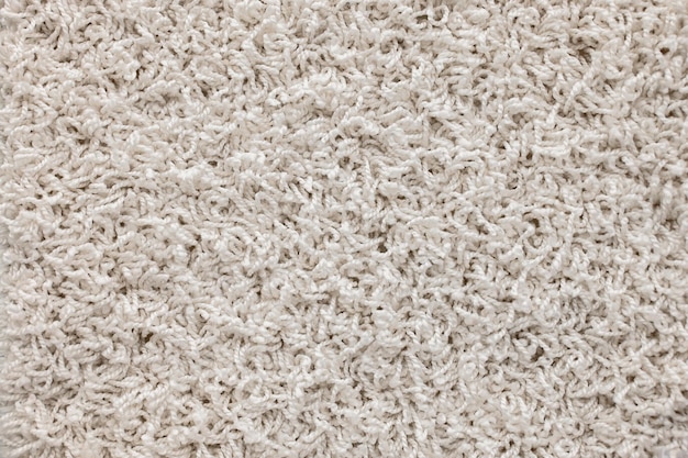 Lekki dywan kudłaty Abstrakcyjne tło kudłatych beżowych włókien