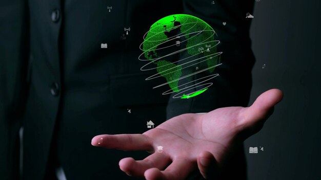 Zdjęcie ludzka ręka trzyma holograficzną technologię kuli ziemskiej