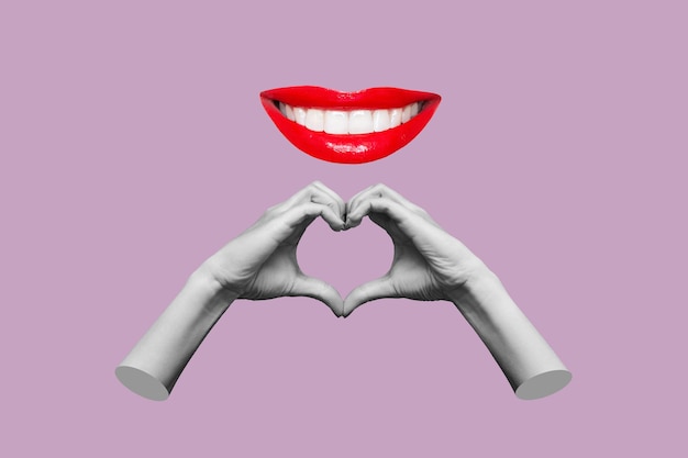 Ludzkie kobiece dłonie pokazujące kształt serca i uśmiechnięte usta z czerwonymi ustami