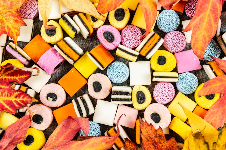 Zdjęcie lukrecja candys background, spadek cukierki na koc z wełny