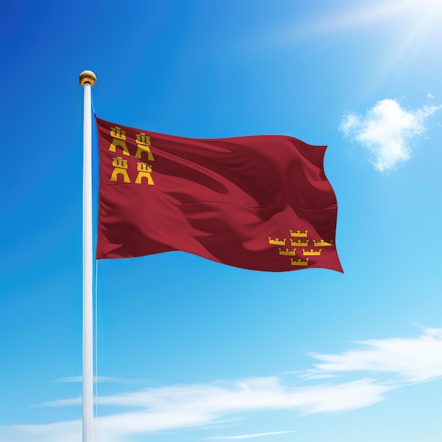 Macha flagą Murcji to wspólnota Hiszpanii na maszcie na tle nieba