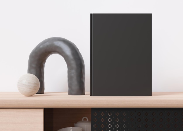 Makieta czarnej okładki książki z akcesoriami domowymi na kredensie Pusty szablon do twojego projektu Widok z przodu zbliżenie Prezentacja okładki katalogu książki Renderowanie 3D