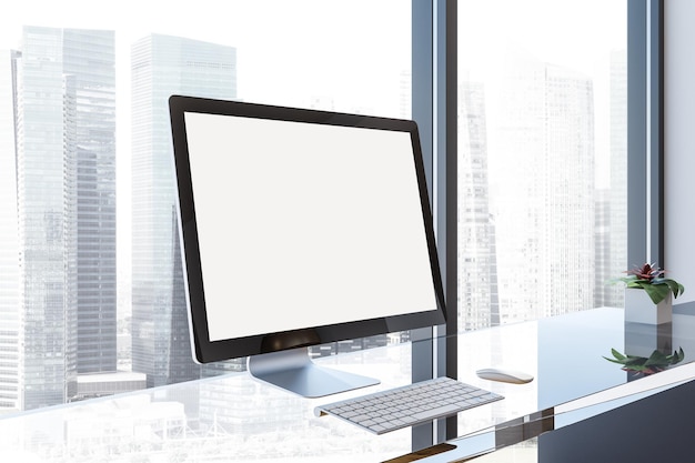 Makieta ekranu monitora komputera stojącego na szklanym stole w biurze na poddaszu z pejzażem miejskim. Koncepcja marketingu i reklamy. renderowania 3D