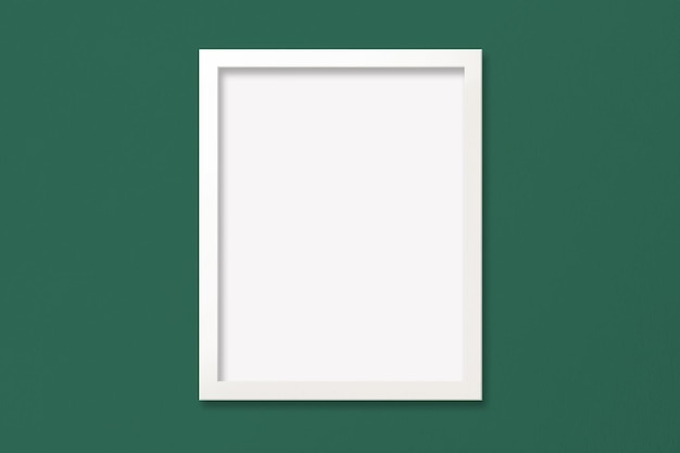 Zdjęcie makieta plakatu z białą ramką na zielonej ścianie z teksturą