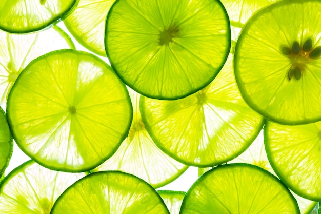 Makro LimeLemon i zielona limonka nakładały się na plasterki zbliżenie tła