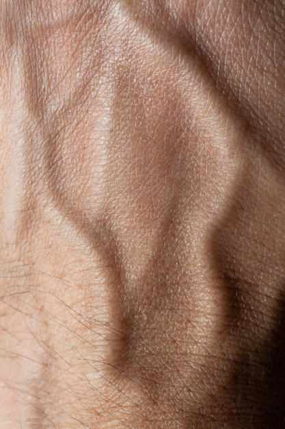 Zdjęcie makro tekstura ludzkiej dłoni, tekstura skóry ludzkiej dłoni.