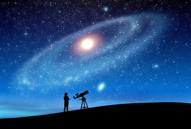 Zdjęcie mały człowiek obserwujący przez teleskop ogrom wszechświata i gwiazd
