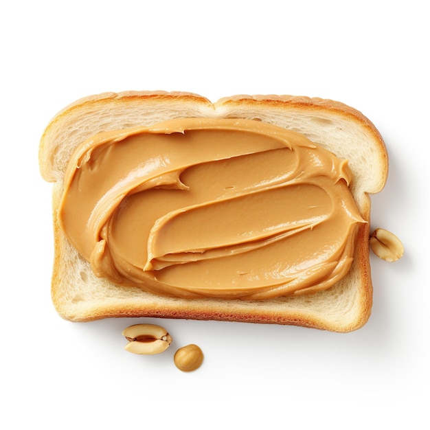 Zdjęcie masło orzechowe na plasterku chleba na białym tle