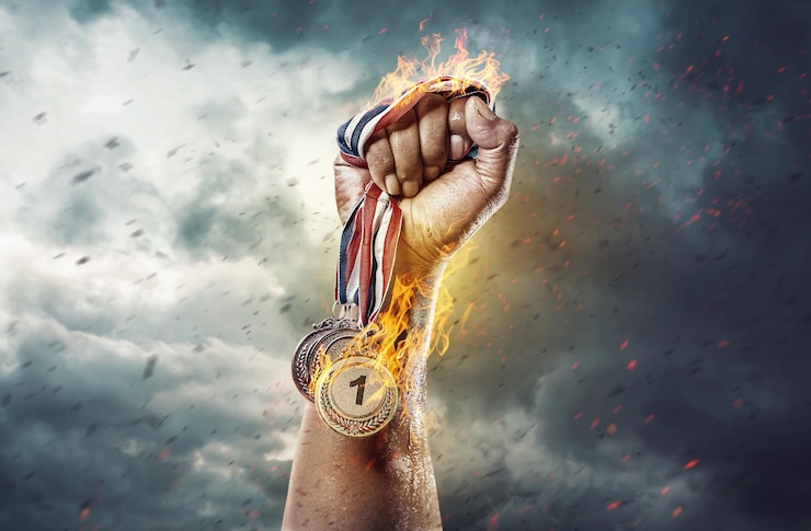 Zdjęcie medal za pierwsze miejsce na tle nieba koncepcja zwycięstwa ogień i energia