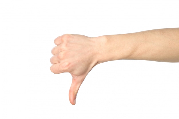 Zdjęcie męski ręka kciuka puszek, odosobniony na białym tle. gesty