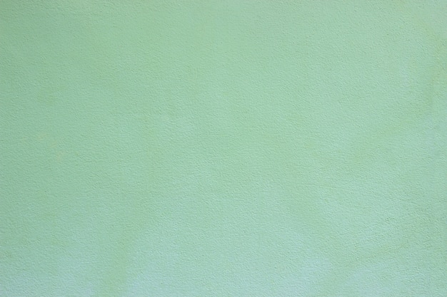 Zdjęcie miękka, zielona betonowa powierzchnia ściany i cement