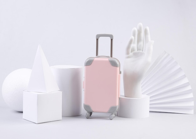 Mini bagaż podróżny z geometrycznymi kształtami na białym tle Grafika koncepcyjna