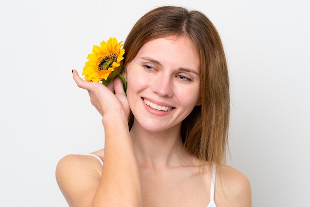 Młoda Angielka trzymająca słonecznik z uśmiechem Zbliżenie portretu