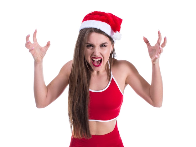 Młoda piękna sportowa kobieta w świątecznym kapeluszu na białym tle szalona i szalona
