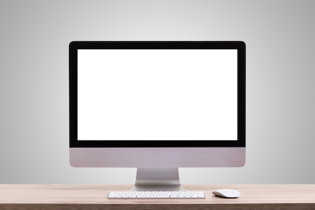 Monitor komputerowy na stole na szarym tle