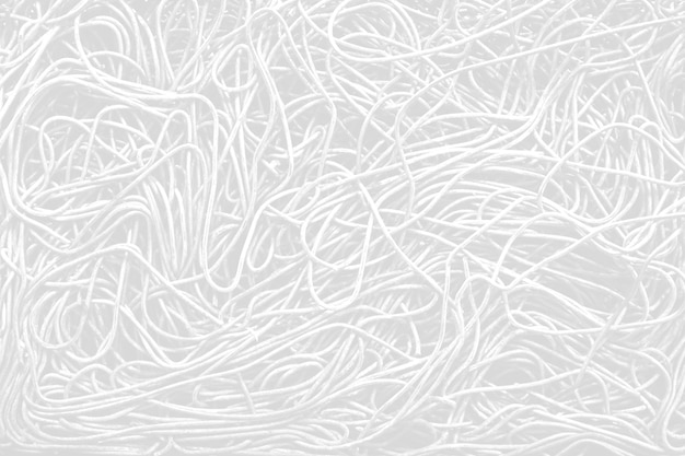 Zdjęcie monochromatyczne, czarno-białe, jasnoszare, niechlujne plecionki z drutu metalowego stalowe teksturowane tło