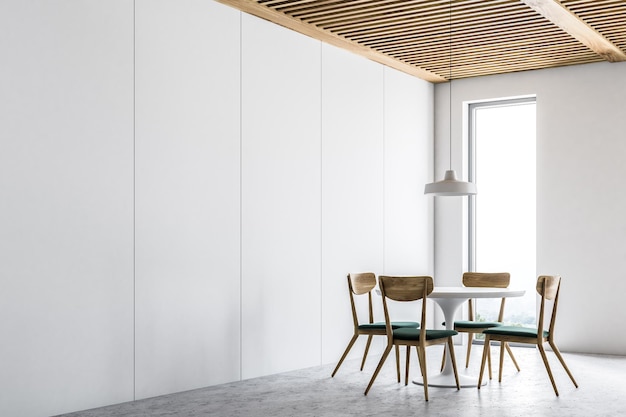 Narożnik białej jadalni z betonową podłogą, wąskim oknem i stojącym przy nim okrągłym stołem z krzesłami. Makieta renderowania 3D