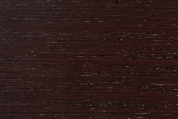 Zdjęcie naturalne ciemnobrązowe drewniane tło na makro teksturze drewna