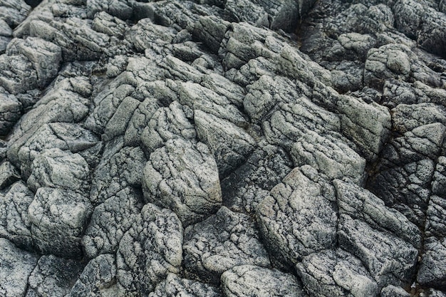 Naturalny kamień tło szara szorstka lawa bazaltowa skała