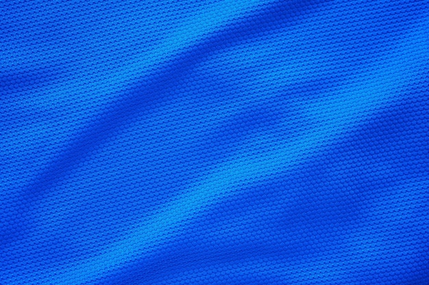 Niebieska koszulka piłkarska odzież tkanina tekstura sport nosić tło zbliżenie widok z góry