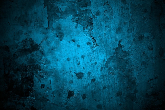 Niebieska ściana Straszna tekstura na tle Ciemno niebieski pęknięty cement
