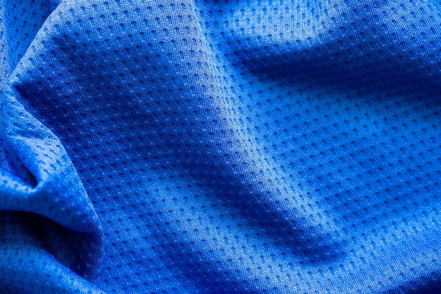 Niebieska tkanina sportowa odzież sportowa koszulka piłkarska z tłem tekstury siatki powietrznej