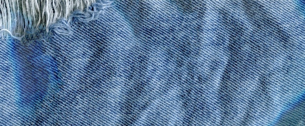 Niebieski denim dżinsowy tekstury tła Dżinsy podarte tekstury tkaniny