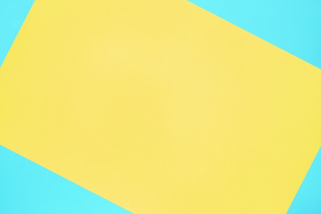 Niebieski i żółty pastelowy kolor tekstury papieru widok z góry minimalne płaskie tło świecące