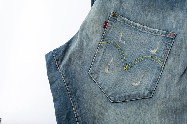 Niebieskie dżinsy denim z transparentem tekstury szwu z miejsca kopiowania tekstu projekt tła. Płótno jeansowe modne dżinsy i tekstura kieszeni. Panoramiczny baner mody