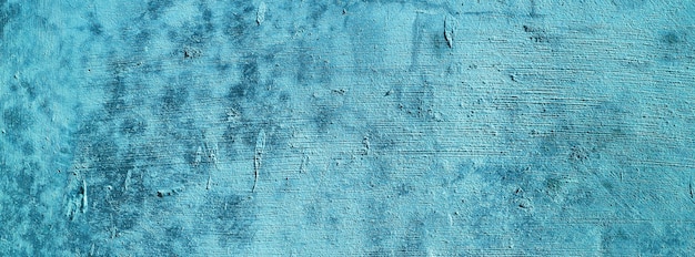 Niebieskie tło ścianybetonowa ściana otynkowane niebieskie tło zarysowaniatekstura grunge