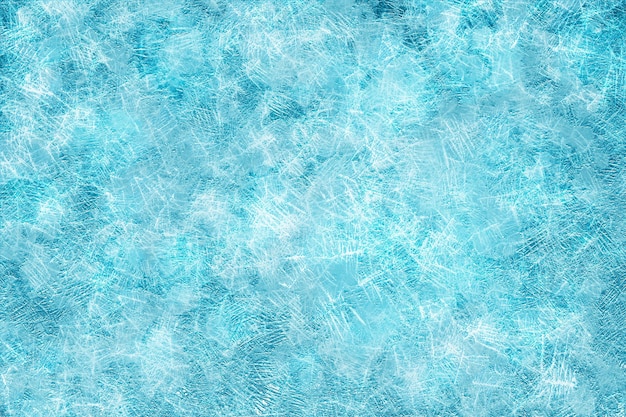Niebieskie zimowe tło z ornamentem mrozu