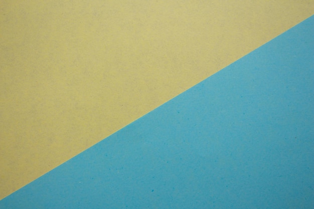 Niebiesko-żółta tapeta z niebieskim i żółtym tłem.
