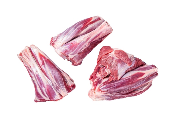 Niegotowane surowe jagnięce golonki mięso baranie na kuchennym stole izolowane na białym tle
