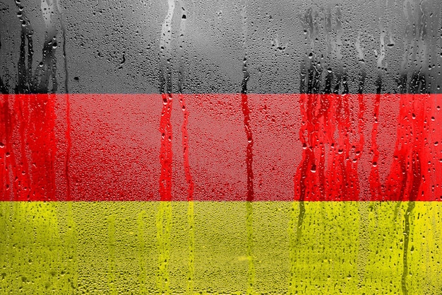 Niemcy flaga oficjalne kolory i proporcje poprawnie Narodowa flaga Niemiec na fakturze kondensacji kropli wody