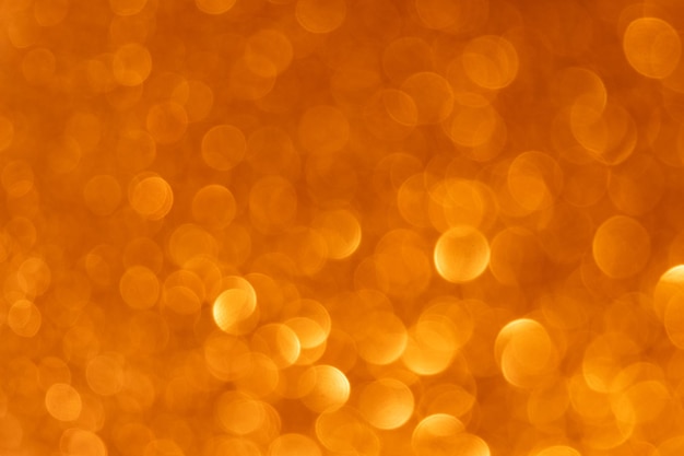 Nieostre światło nakładki Koła bokeh Brokat tekstury Musujące bąbelki Rozmycie blask złoty pomarańczowy okrągłe plamki blask wzór streszczenie tło
