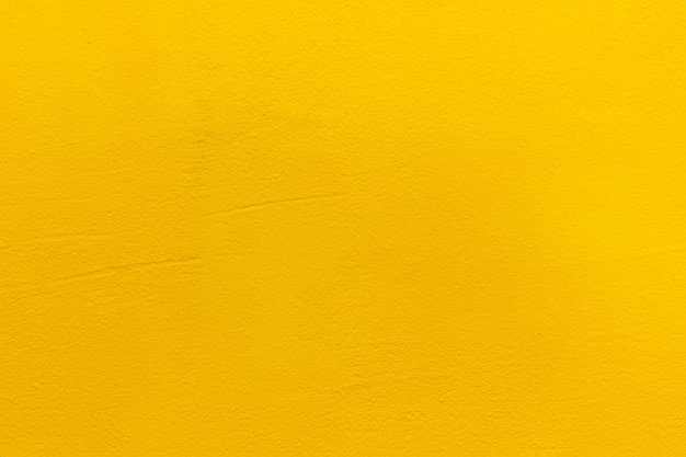 Niewyraźne żółte tło ścian z sztuką żółta tekstura malowanej ściany z cementem