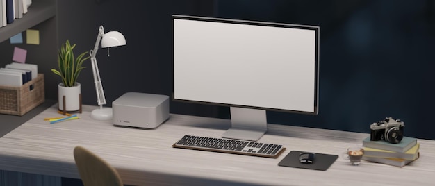 Zdjęcie nowoczesne biuro biurowe z makietą komputera pc na stole nad czarną ścianą