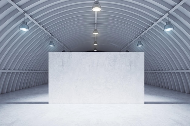 Nowoczesne lekkie wnętrze hangaru wystawowego z pustą szarą ścianą i betonową podłogą Koncepcja prezentacji Makieta renderowania 3D