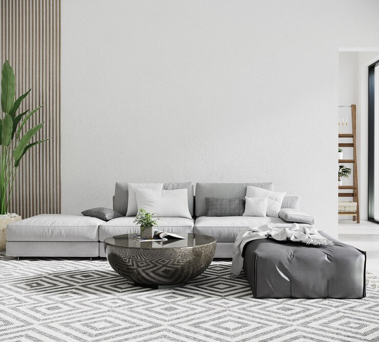 Nowoczesny salon z szarą sofą i stołem