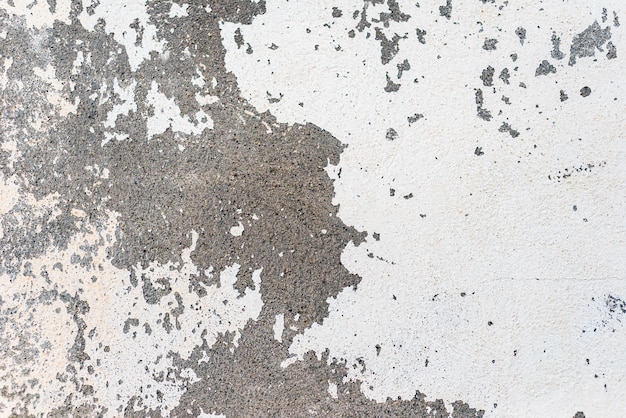 Oczyszczona biała farba na starej betonowej ścianie Abstrakcyjne tło teksturowane
