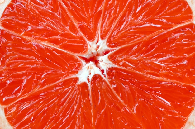 Odgórny widok czerep grapefruitowy plasterka zakończenie w górę tła