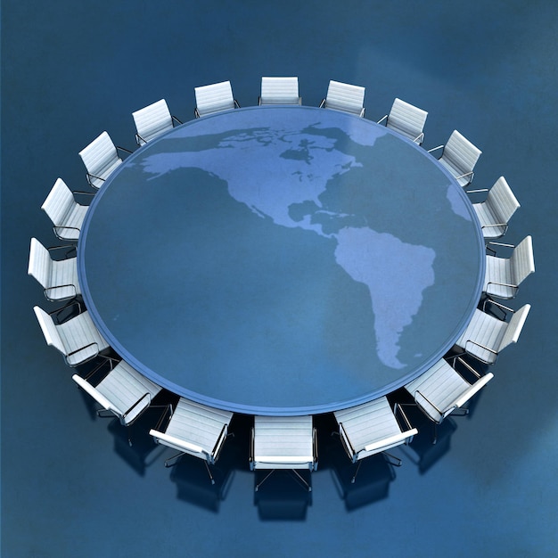 Okrągły stół konferencyjny z mapą świata pośrodku Ameryki