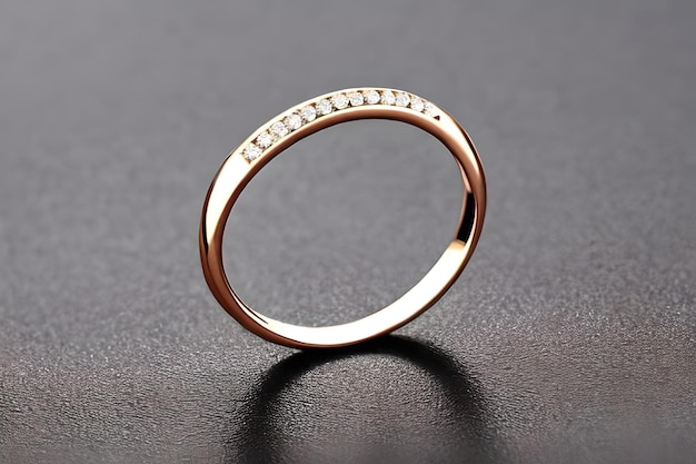 Oszałamiające zbliżenie pojedynczych obrączek delikatnie splecionych, aby symbolizować wieczną więź miłości i zaangażowania Biżuteria złoty pierścionek z brylantem na rocznicę walentynek lub zaręczyny