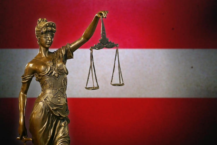Zdjęcie pani sprawiedliwość przeciwko fladze austrii