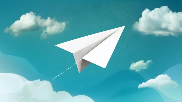Papierowy samolot unoszący się pośród spokojnego niebieskiego nieba ozdobionego chmurami