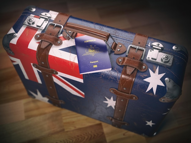 Paszport Australii i walizka z flagą Australii Koncepcja podróży lub imigracji