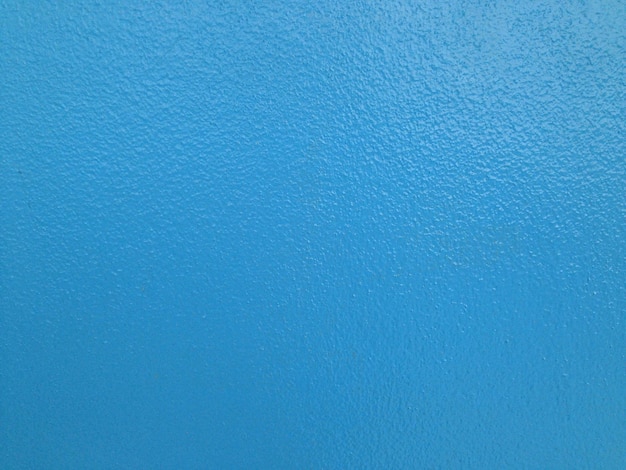 Zdjęcie pełna kadra niebieskiej ściany
